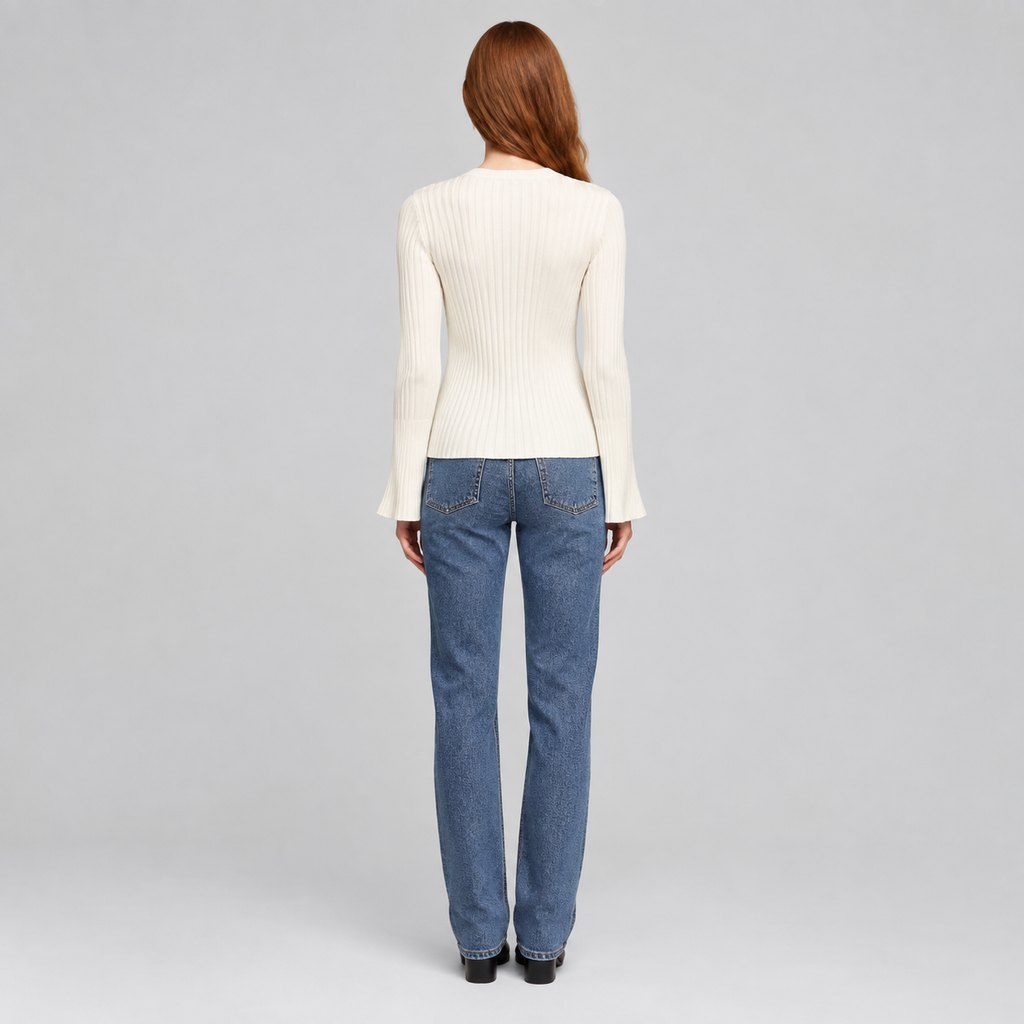 Cream ribbed knit sweater worn by a model, front view — view 4